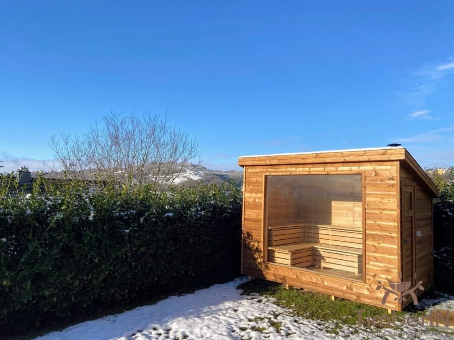 Sauna infrarouge extérieur 1 Sauna extérieur TimberIN Nordic Vista avec façade vitrée
